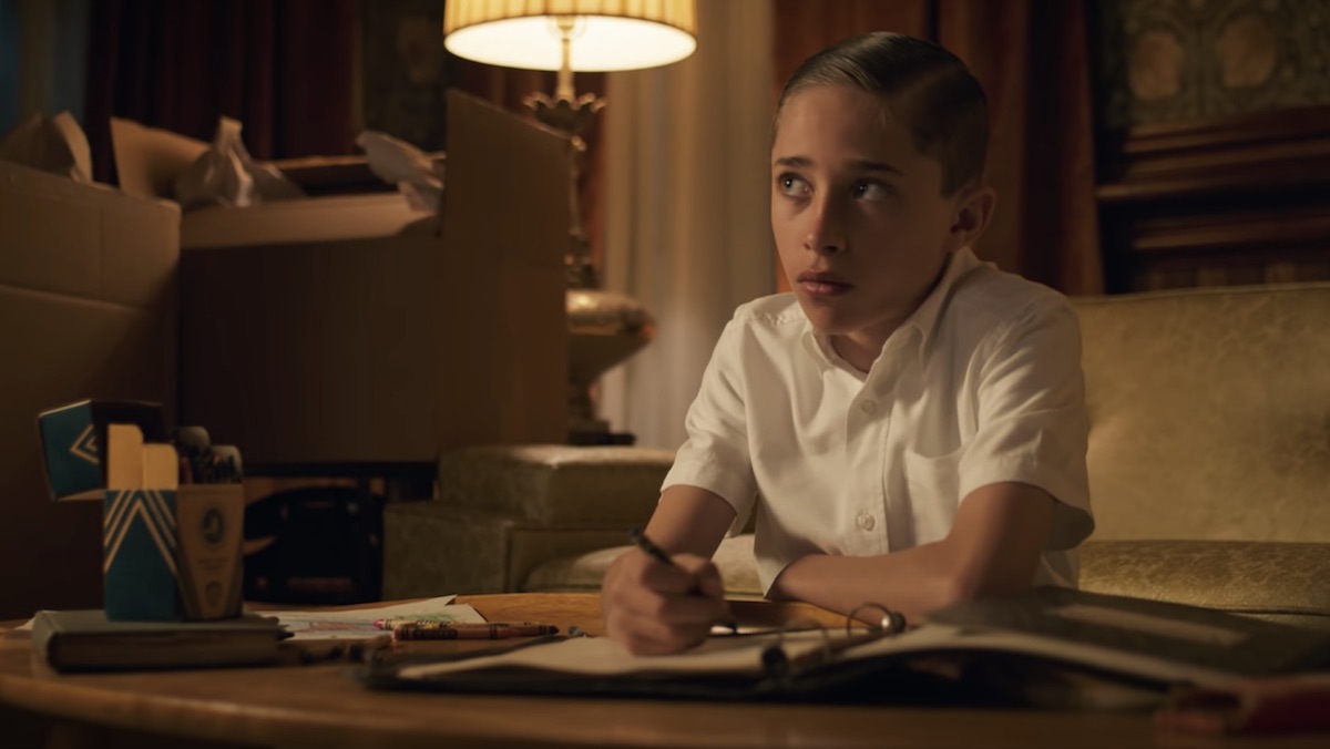 Young Henry Creel sits at his desk on Stranger Things 4