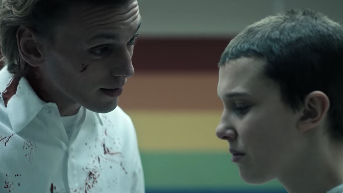 a bloodied One talks to Eleven in Hawkins Lab on Stranger Things 4